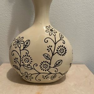 8.5”H Cream Vase with Black floral etchings.